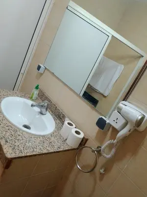 a bathroom counter with a sink and a mirror at House of Diamonds in Marrakech