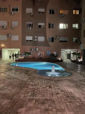 a swimming pool in the middle of a building at Appartement Marrakech Gueliz in Marrakech