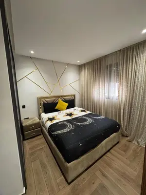 a bedroom with a large bed in a room at Stylish 2-Bed Retreat in Marrakech Free Parking in Marrakech
