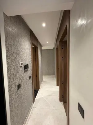 an empty hallway with two doors and a hallway at Stylish 2-Bed Retreat in Marrakech Free Parking in Marrakech