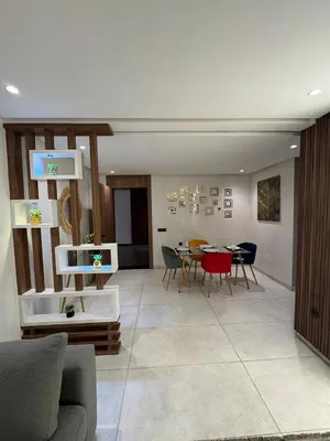 a living room with a couch and a table at Stylish 2-Bed Retreat in Marrakech Free Parking in Marrakech