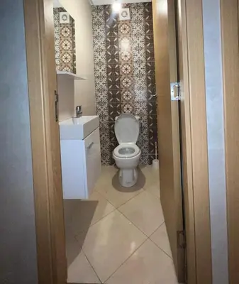 a bathroom with a toilet and a sink at appartement 2 chabres marrakech in Marrakech