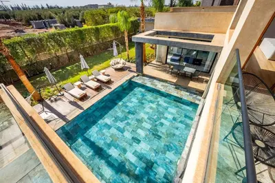 an overhead view of a swimming pool in a house at Palais Mahora in Marrakech