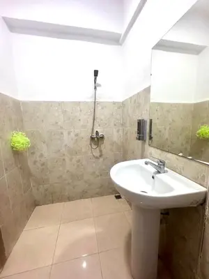 a bathroom with a sink and a mirror at Apartment in Marrakech near McDonald's Massira in Marrakech