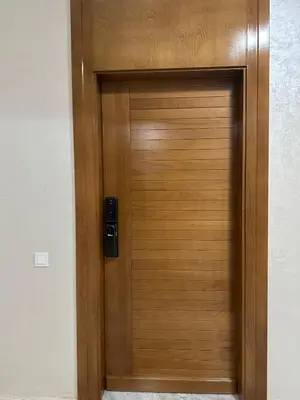 a wooden door with a speaker on it at Appartement Moderne à Guéliz in Marrakech