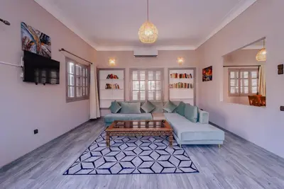 a living room with a couch and a tv at Maison du Pacha in Marrakech