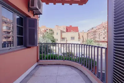 a balcony with a view of a city at Maison du Pacha in Marrakech