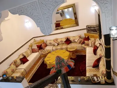 a living room with a couch and a table at Riad Alhana in Marrakech