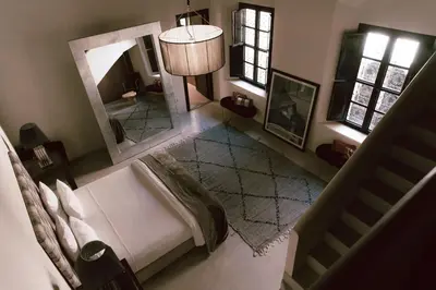 an overhead view of a living room with a couch and a mirror at Riad K in Marrakech