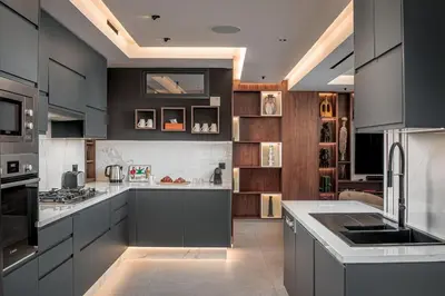 a kitchen with gray cabinets and a counter top at Luxury 3 bedroom with private pool and spa in Marrakech