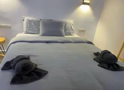 two towels are sitting on a bed in a room at Welcome to Riad Mariam & Maïwenn! in Marrakech