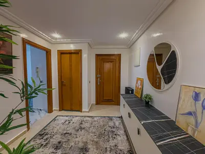 a room with a hallway with a door and a rug at Essalmi Luxury Apartment Gueliz in Marrakech