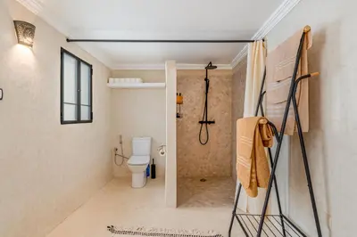 a bathroom with a toilet and a shower at Riad with Rooftop Terrace in Top Medina Location, Dar El Bacha in Marrakech