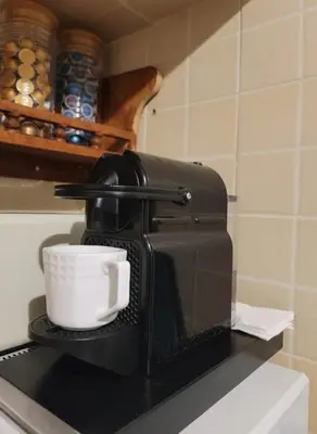 a coffee maker sitting on a counter with a cup at Dar'ESTRELLA calme 15min Jemaa ElFna parking free in Marrakech