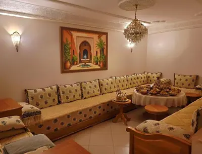 a living room with a couch and a table at Dar'ESTRELLA calme 15min Jemaa ElFna parking free in Marrakech