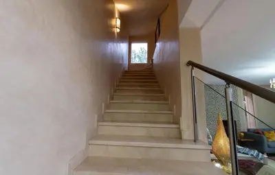 a staircase in a house with a window at Villa Sophia in Marrakech