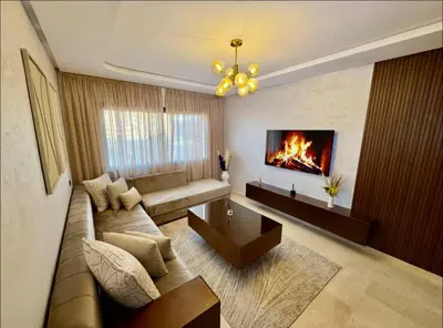 a living room with a couch and a fireplace at New apartment - Gueliz - Pool in Marrakech