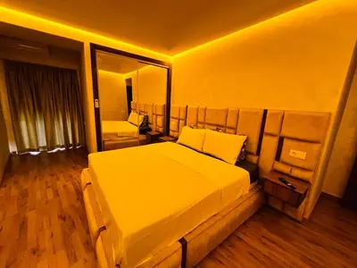 a bedroom with a large bed and a large mirror at Modern & Central Apartment in Marrakech