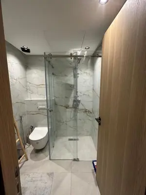a bathroom with a shower and a toilet at Aube d hivernage Marrakech in Marrakech