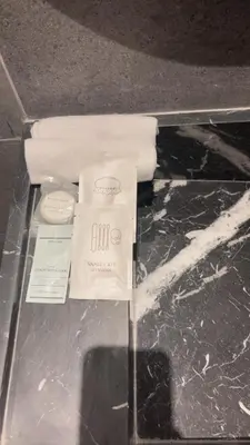 a package of toilet paper on a glass table at Luxurious 2 Bedrooms in Gueliz Pool View in Marrakech