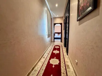 a hallway with a red carpet on the floor at Marrakech Luxury Escape Full Villa Pool & Garden in Sraghna