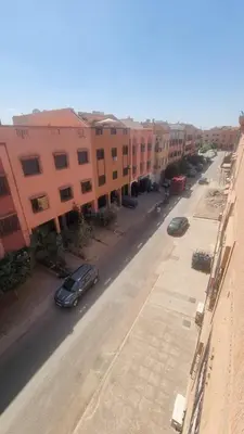 an aerial view of a street with buildings and cars at Appartement Atlas in Marrakech