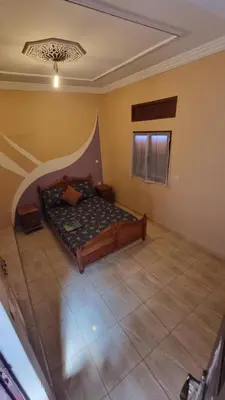 a bedroom with a bed in a room at Appartement Atlas in Marrakech