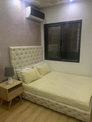 a bedroom with a bed and a window and a bed sidx sidx sidx at 2 Bedroom Apartment Calm Area Parking in Marrakech