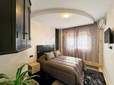 a bedroom with a bed in the middle of it at Confort Moderne au Cœur de Marrakech Proche Gare in Marrakech