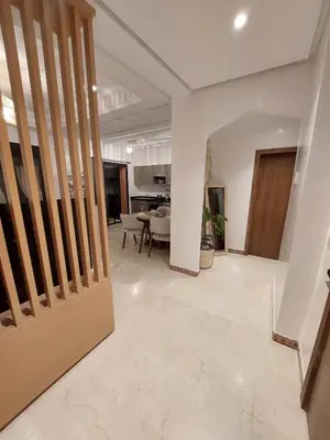 a living room with a door and a dining room at Marrakchi Home, Vintage Terrace Overlooking Pool in Marrakech
