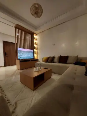 a living room with a couch and a coffee table at Marrakchi Home, Vintage Terrace Overlooking Pool in Marrakech