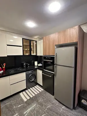 a kitchen with a refrigerator and a dishwasher at City Chic New build Apartment in Marrakech