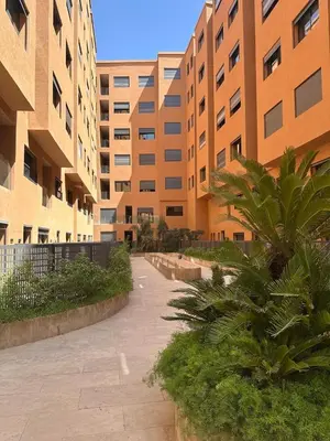 a walkway in front of a large building at City Chic New build Apartment in Marrakech
