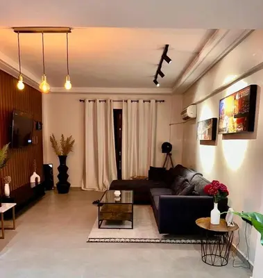a living room with a couch and a table at Apartment near Gueliz and Majorelle in Marrakech