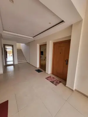 a large hallway with a door and a tile floor at Luxury Apartment Les Cerisiers Marrakech in Marrakech