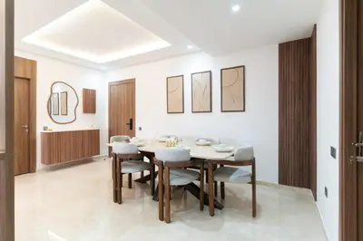 a dining room with a table and chairs at Menara Suite Harmonie , Terrasse et Piscine in Marrakech