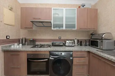 a kitchen with a washer and dryer in it at Villa Sara - 3 Rooms with private pool in Marrakech