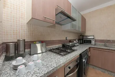 a kitchen with a stove and a counter top at Villa Sara - 3 Rooms with private pool in Marrakech
