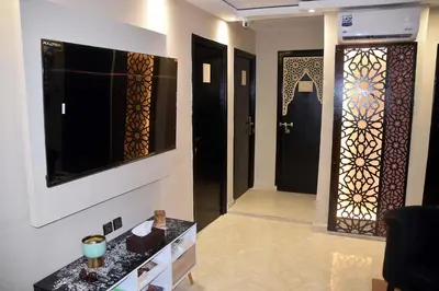 a room with a hallway with a door and a television at Lyron Hostel & Privates rooms Gueliz in Marrakech