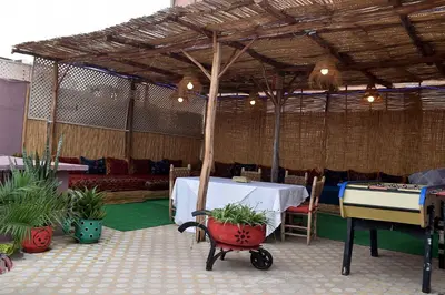 a room with a table and a ping pong table at Lyron Hostel & Privates rooms Gueliz in Marrakech