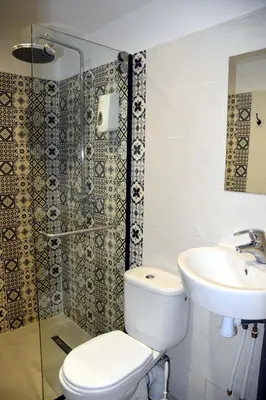 a bathroom with a toilet and a sink and a shower at Lyron Hostel & Privates rooms Gueliz in Marrakech