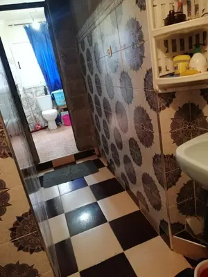 a bathroom with a sink and a toilet and a sink at famile 154 in Marrakech