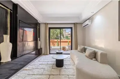 a living room with a couch and a table at Simone moves to Guéliz in Marrakech