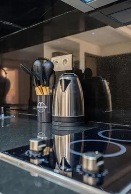 a kitchen counter with two coffee pots and utensils at Simone moves to Guéliz in Marrakech