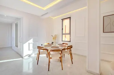 a dining room with a table and chairs at Private Luxury Penthouse Marrakech with Jacuzzi & Pool in Marrakech