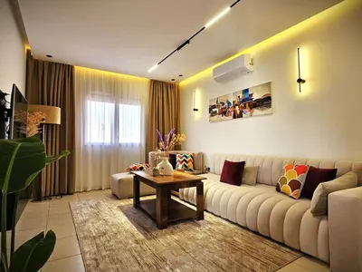 a living room with a couch and a table at Amber Haven in Marrakech