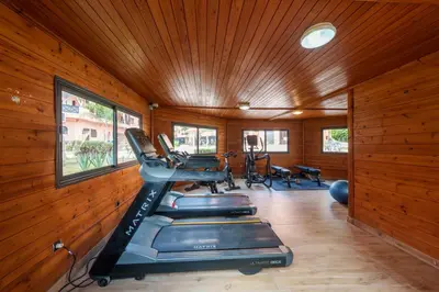 a gym with treadmills and exercise equipment in a room at New 2BR Apartment in Marrakech with Pools, Gym, Security & Terrace in Marrakech