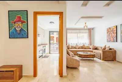 a living room with a couch and a table at Luxury apartment in Hivernage in Marrakech
