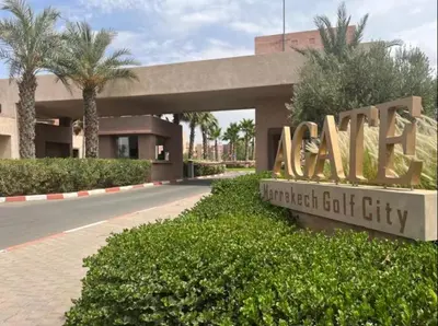 a sign for the entrance to a financial cut city at Prestigia Golf View - Piscine & terrasse in Marrakech