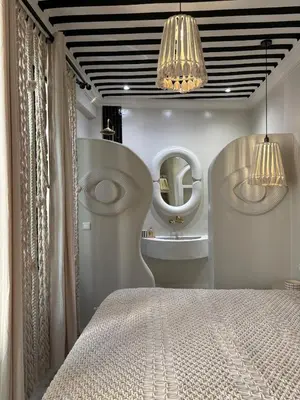 a bedroom with a bed and a mirror at Private Riad in Marrakech Medina in Marrakech